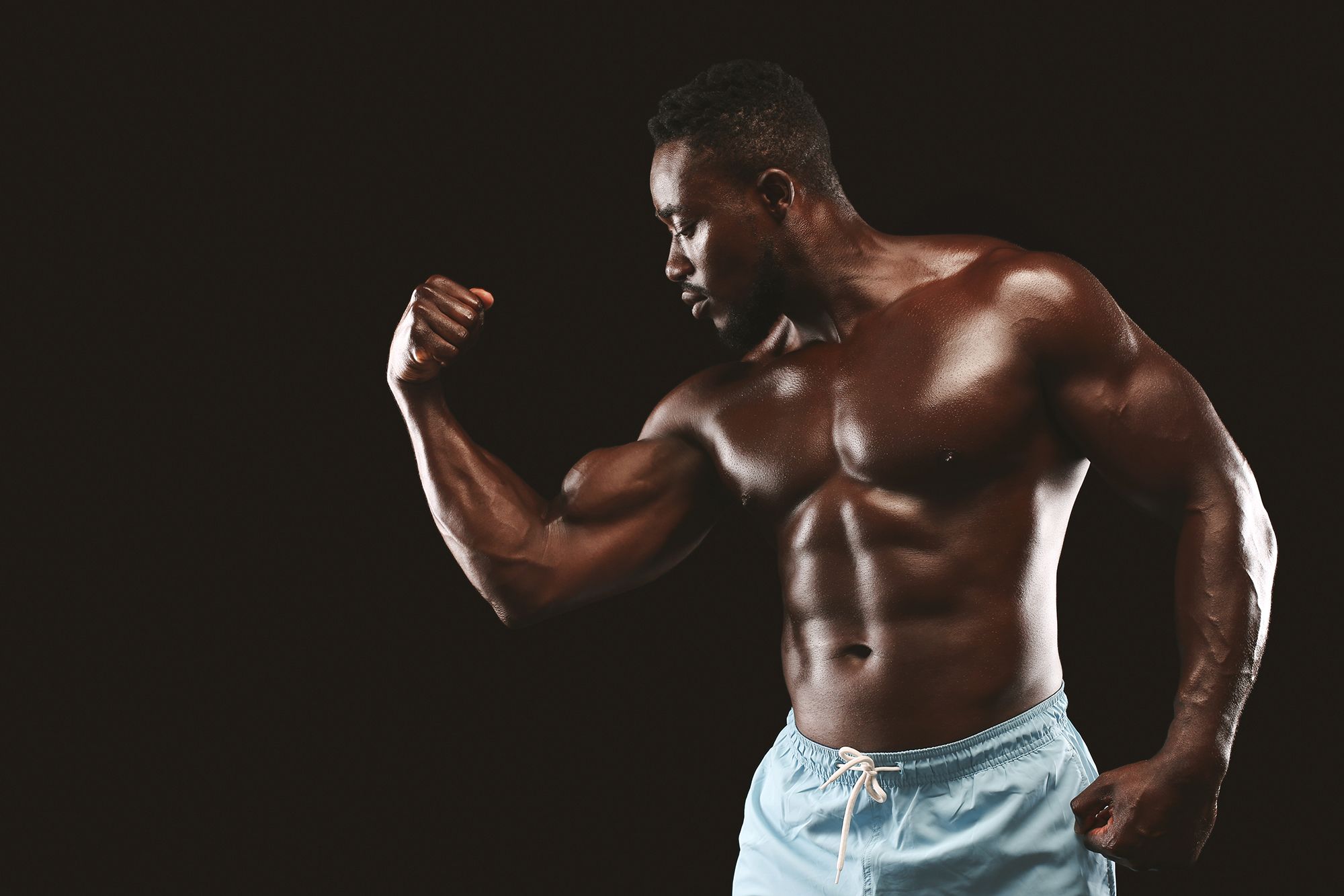 bodybuilder demonstrating his biceps