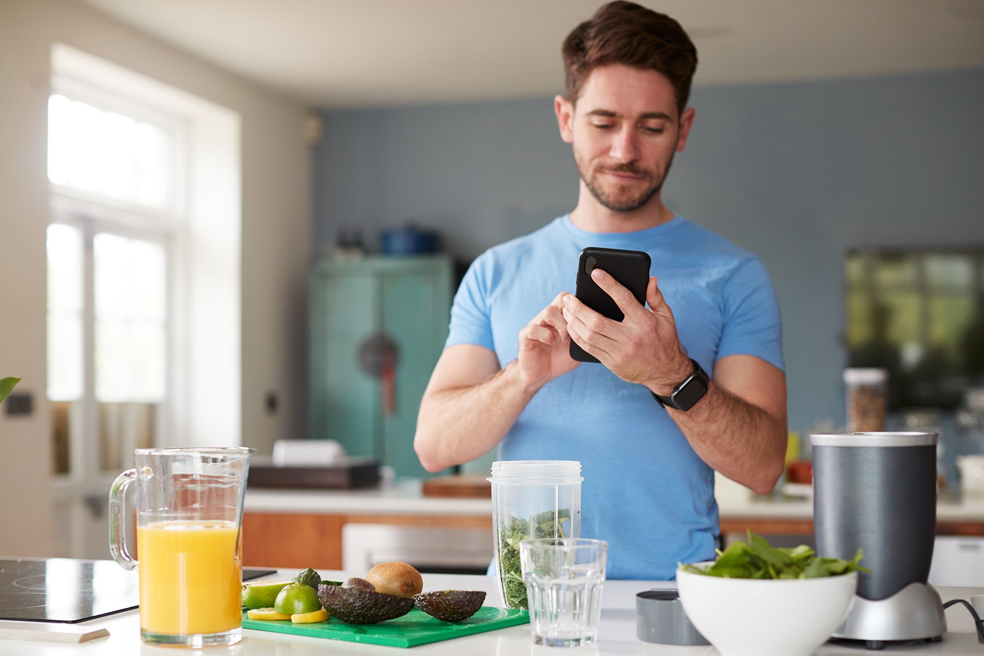 man using fitness tracker to count calories