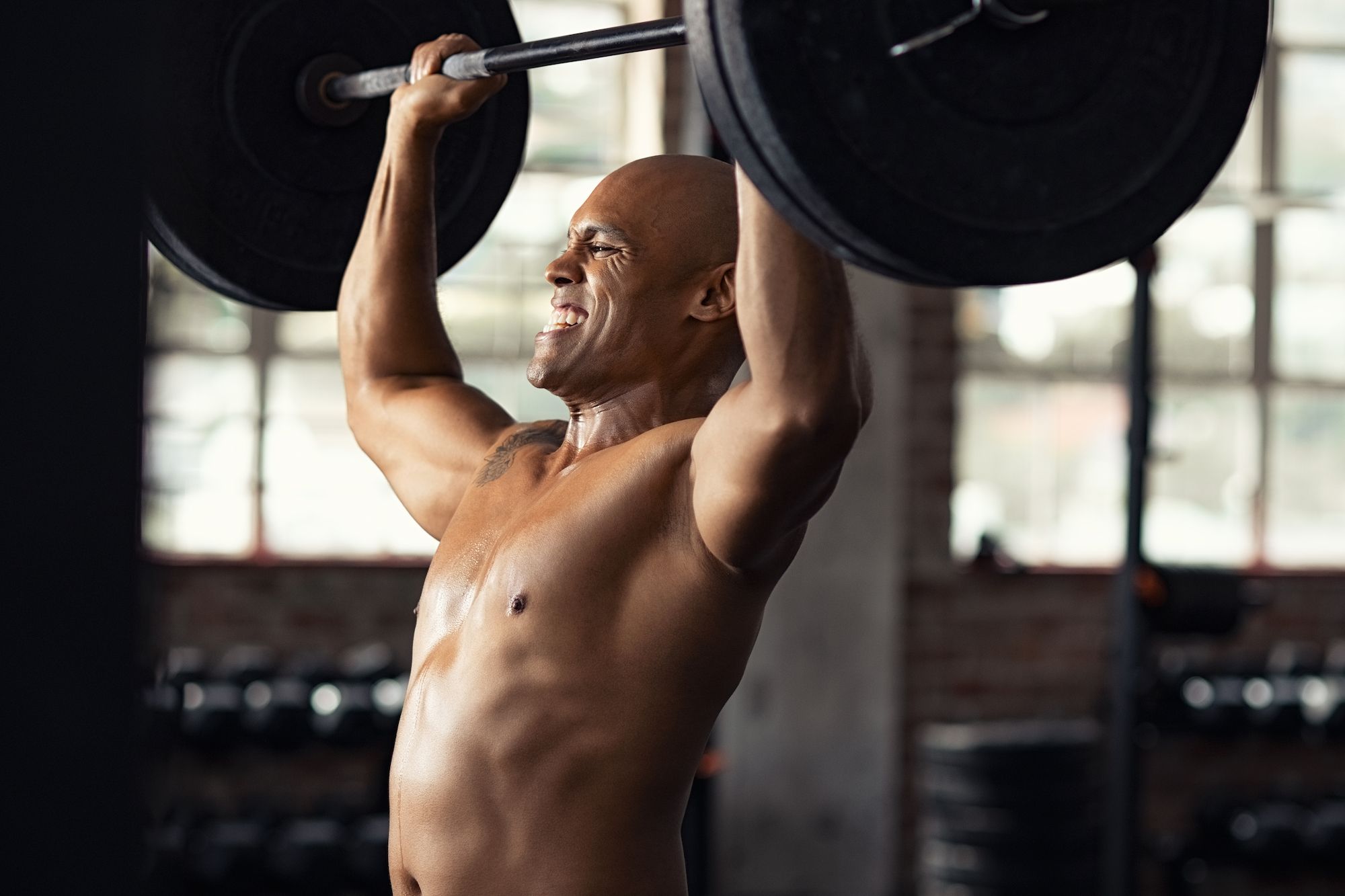 strong man doing weight lifting